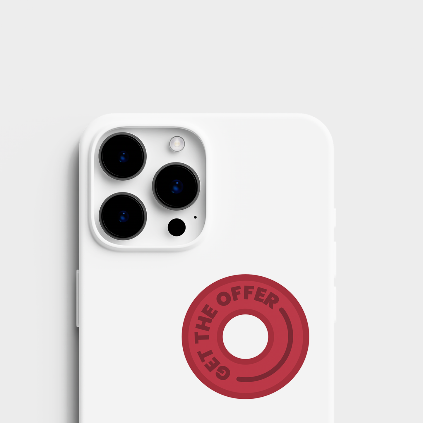 A top view of the sticker set alongside a sticker applied to an cell phone