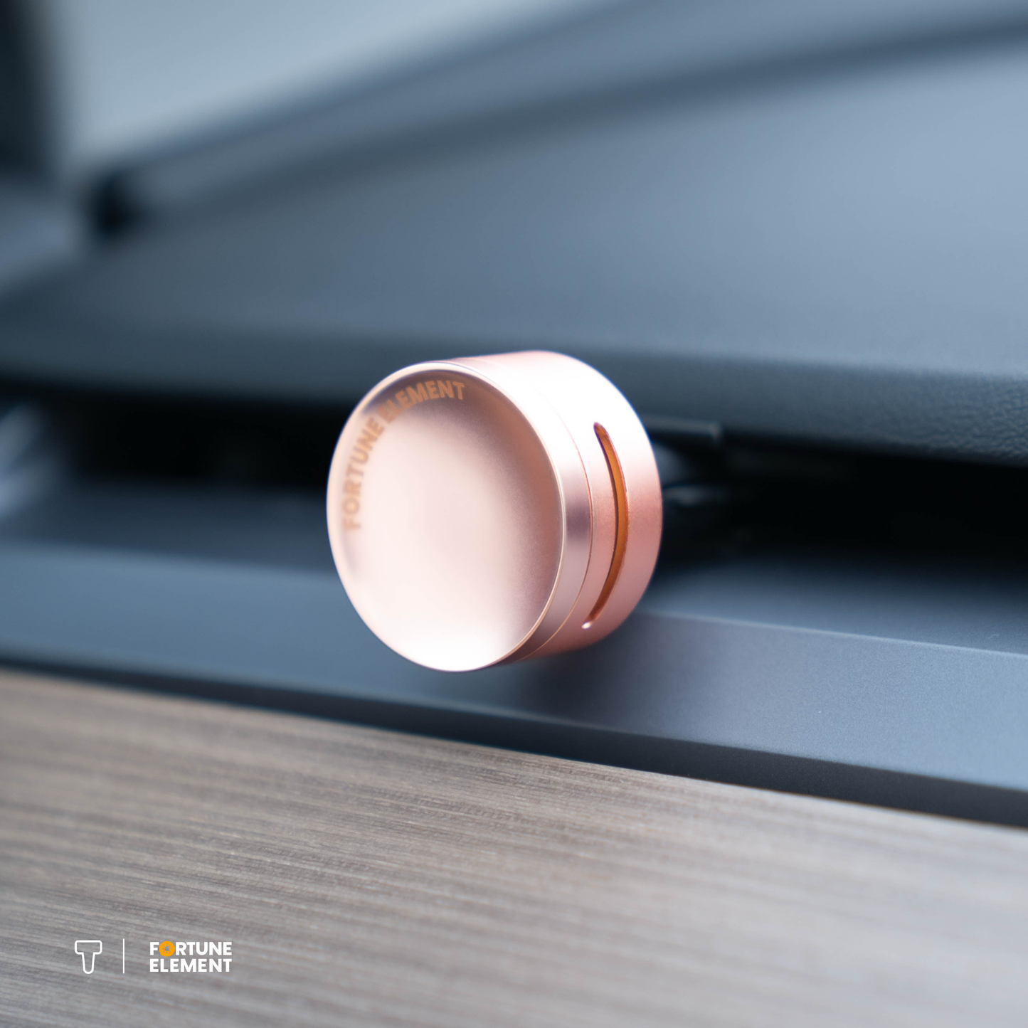 A close-up shot of the fortune element car diffuser clipped into the tesla vent, highlighting its secure attachment and integration with the vent design