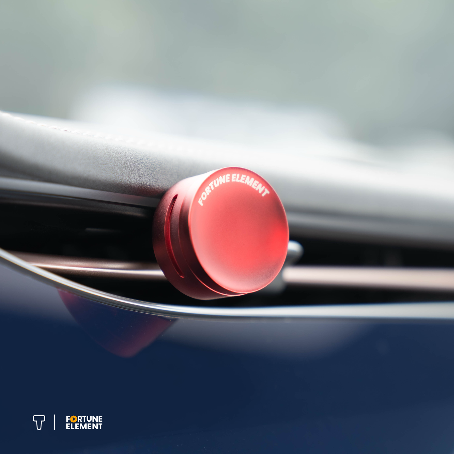 A close-up shot of the fortune element car diffuser clipped into the car's vent, highlighting its secure attachment and integration with the vent design