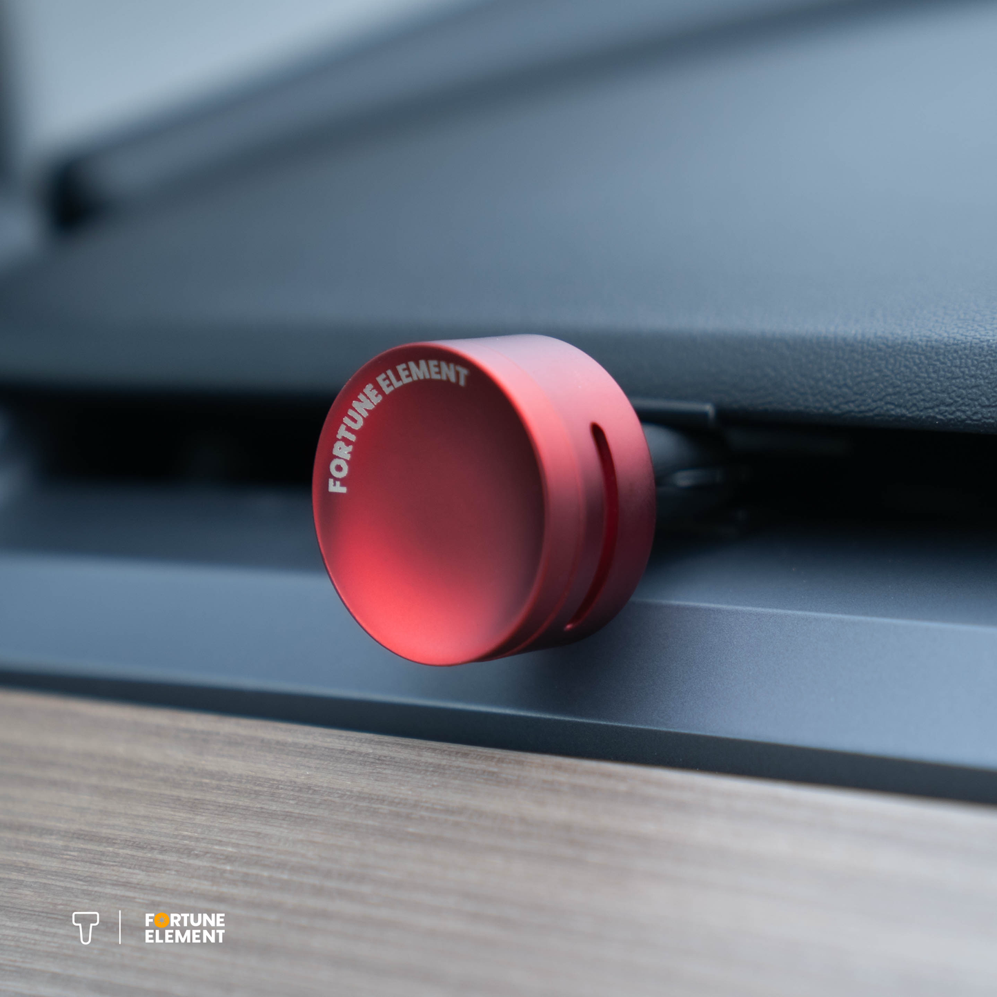 A close-up shot of the fortune element car diffuser clipped into the tesla vent, highlighting its secure attachment and integration with the vent design
