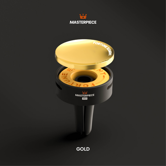 Front view of a luxury car diffuser with a pure gold upper section and a carbon fiber lower section, minimalist design on a white background.