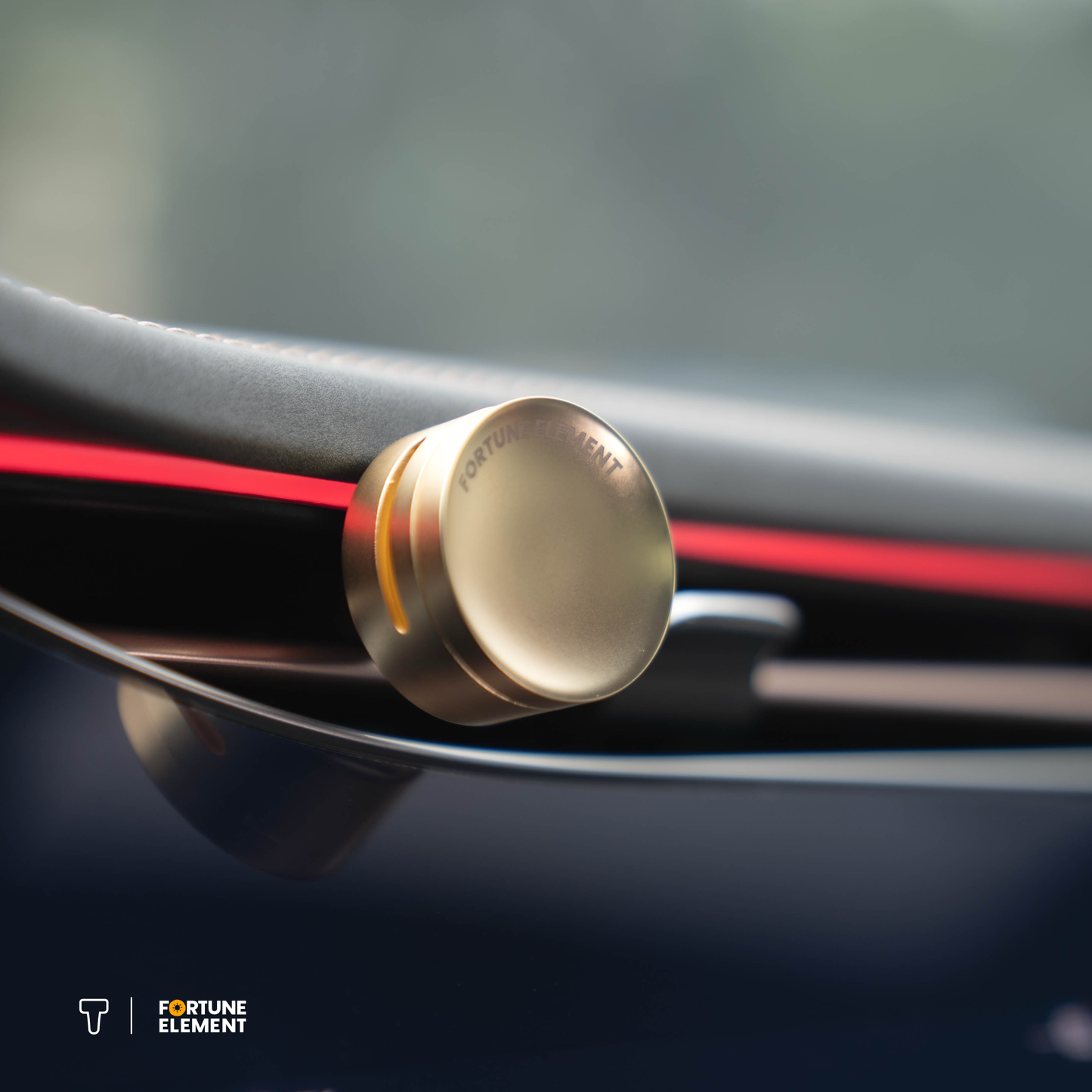 A close-up shot of the fortune element car diffuser clipped into the car's vent, highlighting its secure attachment and integration with the vent design