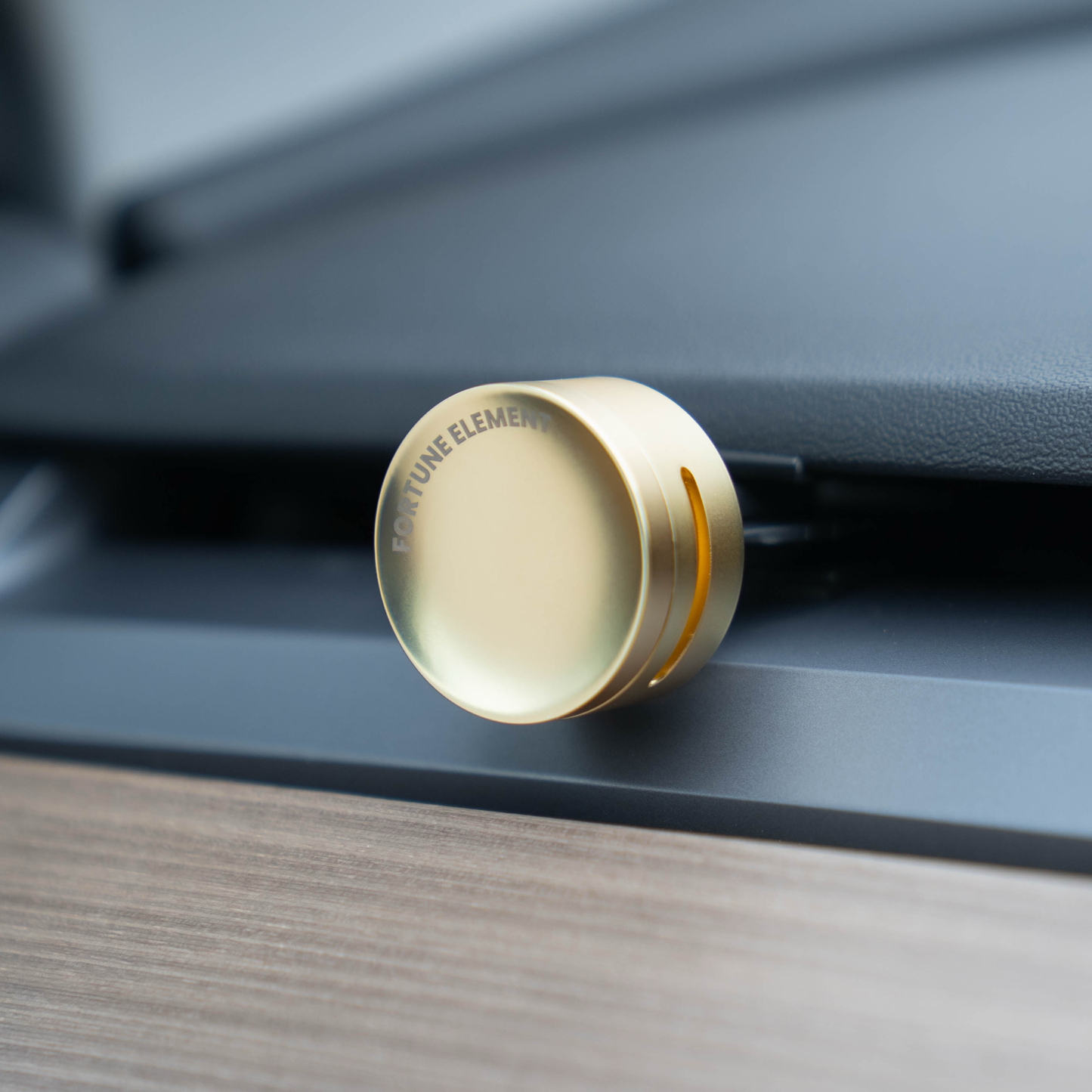 A close-up shot of the fortune element car diffuser clipped into the tesla vent, highlighting its secure attachment and integration with the vent design