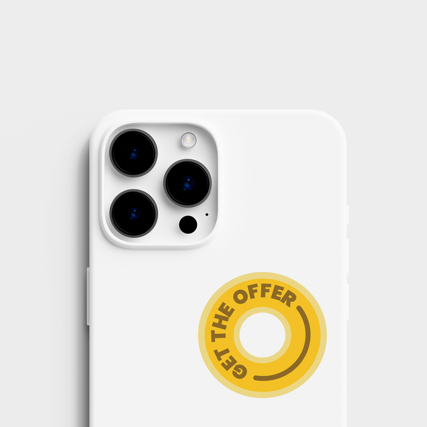 A top view of the sticker set alongside a sticker applied to an cell phone