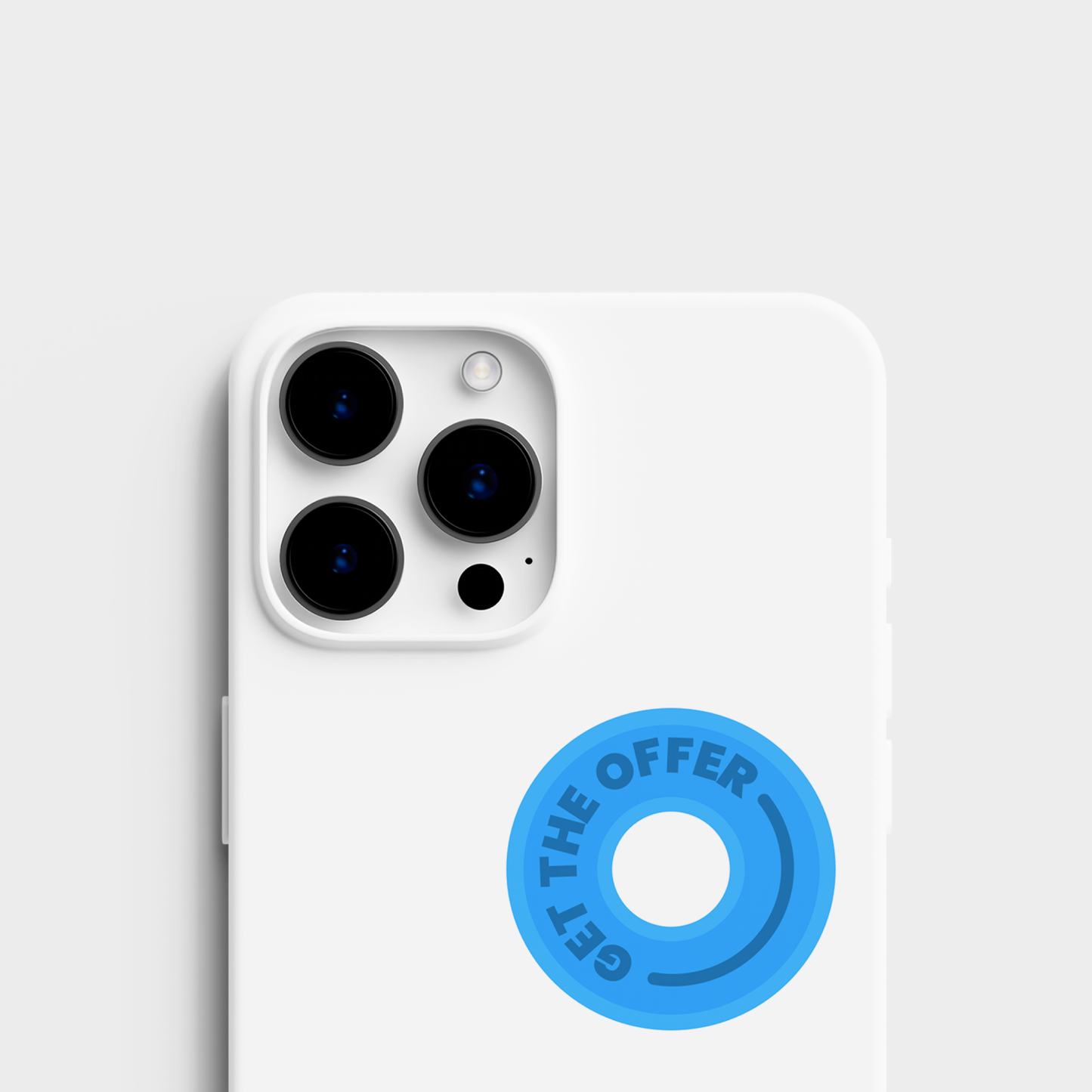 A top view of the sticker set alongside a sticker applied to an cell phone