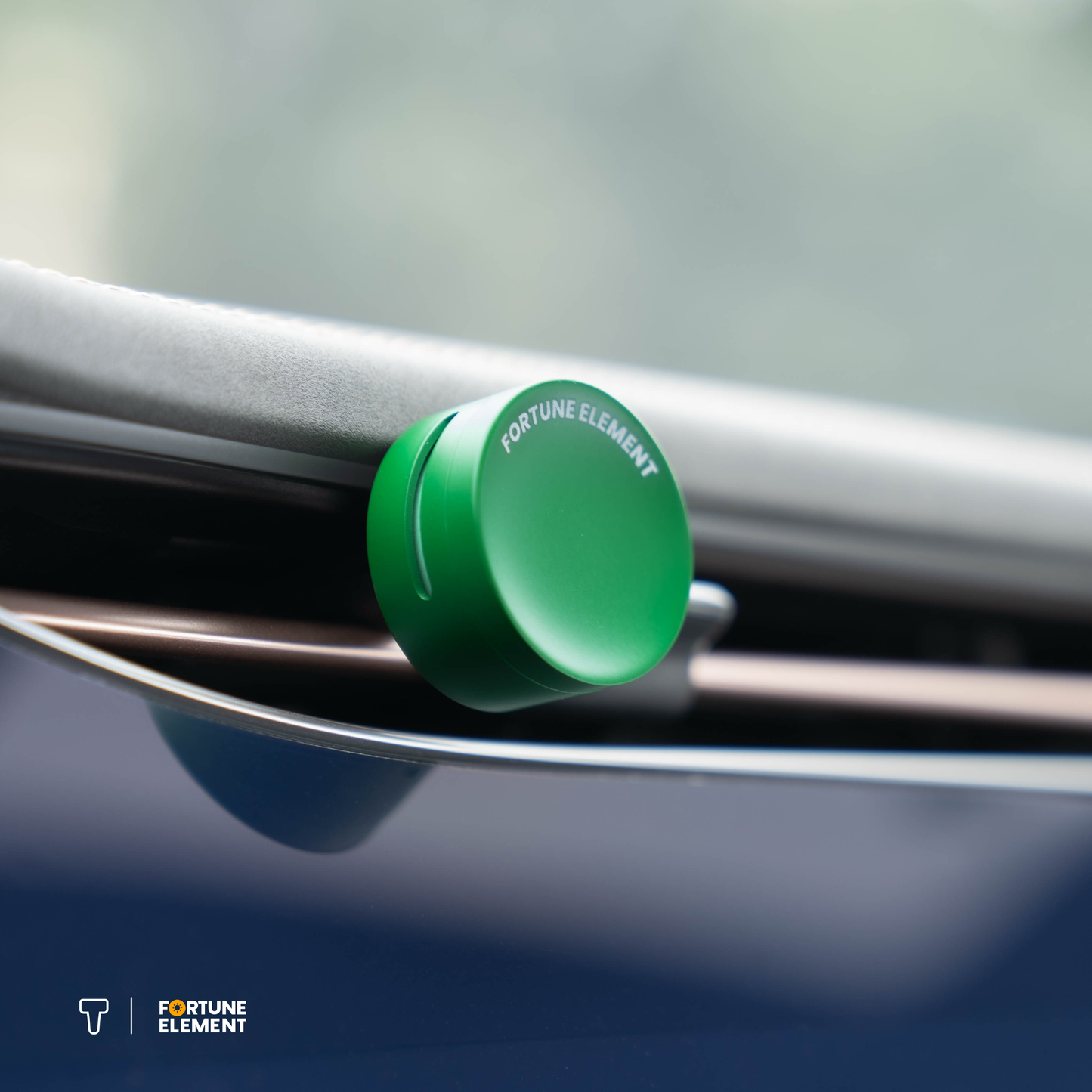 A close-up shot of the fortune element car diffuser clipped into the car's vent, highlighting its secure attachment and integration with the vent design
